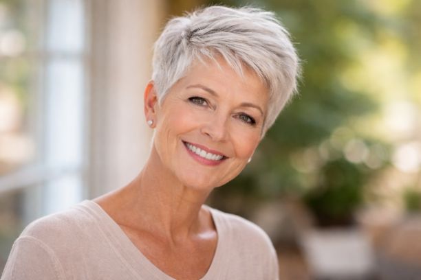 Textured pixie cut hairstyle for women over 60 with fine silver hair and natural volume